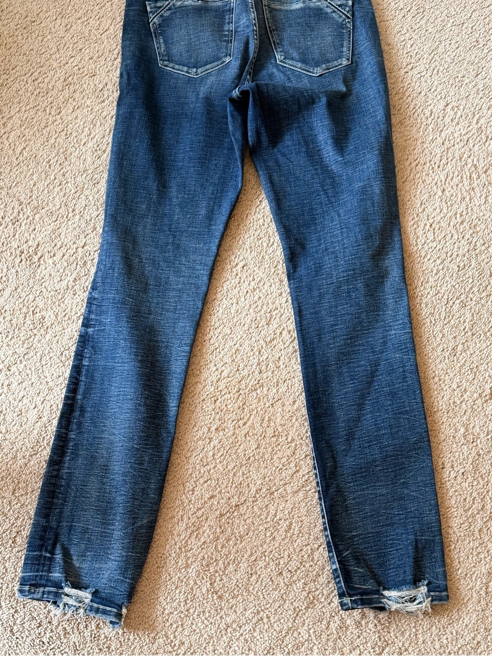Buckle Women's Dark Blue Skinny Jeans with Distressed Hems